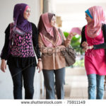 stock-photo--young-muslim-woman-in-head-scarf-walk-together-75911149