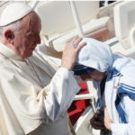 Pope Francis blesses an MC nun after Mother Teresa's canononisation